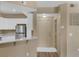 Modern kitchen features stainless steel appliances, white cabinets, and granite countertops at 5512 Metrowest Blvd # 201, Orlando, FL 32811
