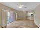 Bright living room with sliding glass door to balcony and a view to the kitchen at 5512 Metrowest Blvd # 201, Orlando, FL 32811
