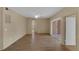 Bright, spacious living room features wood floors, ceiling fan, and sliding glass doors at 5512 Metrowest Blvd # 201, Orlando, FL 32811