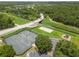 Community recreation area with tennis court, sand volleyball, playground and parking at 5512 Metrowest Blvd # 201, Orlando, FL 32811