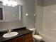 Bathroom featuring vanity with granite countertop and a tub with tile surround at 6100 Stevenson Dr # 207, Orlando, FL 32835