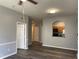 Living room with ceiling fan and pass through to kitchen at 6100 Stevenson Dr # 207, Orlando, FL 32835