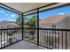 Private balcony with wrought iron railing overlooking the community and parking area at 685 Youngstown Pkwy # 300, Altamonte Springs, FL 32714