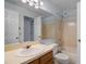 Bathroom features a vanity with a white countertop, a large mirror, and a shower-tub combo at 685 Youngstown Pkwy # 300, Altamonte Springs, FL 32714