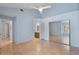 Bright bedroom with light blue walls, ceiling fan, and mirrored closet doors at 685 Youngstown Pkwy # 300, Altamonte Springs, FL 32714