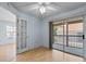 Bedroom features sliding glass door to balcony, providing a great view of the outdoors at 685 Youngstown Pkwy # 300, Altamonte Springs, FL 32714