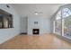 Bright living room with light-colored walls, hardwood floors, and a fireplace at 685 Youngstown Pkwy # 300, Altamonte Springs, FL 32714