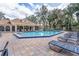 Community pool featuring inviting lounge chairs and covered seating area at 685 Youngstown Pkwy # 300, Altamonte Springs, FL 32714