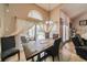 Dining area with tiled flooring and sliding doors that lead to the outdoor patio at 742 Seneca Trl, St Cloud, FL 34772