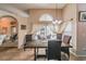 Dining area with tile flooring, opens to outdoor patio and has decorative curtains at 742 Seneca Trl, St Cloud, FL 34772