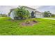 Attractive home exterior with lush green lawn, mature landscaping, and a well-maintained facade at 742 Seneca Trl, St Cloud, FL 34772