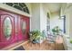 Inviting front porch with double doors, decorative plants, and outdoor seating at 742 Seneca Trl, St Cloud, FL 34772
