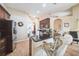 Kitchen featuring dark cabinetry, stainless steel appliances, and counter seating at 742 Seneca Trl, St Cloud, FL 34772