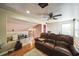 Upstairs living area, offering cozy seating and a workspace with natural lighting at 742 Seneca Trl, St Cloud, FL 34772