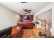 Cozy loft area with comfortable seating, desk, and entertainment setup at 742 Seneca Trl, St Cloud, FL 34772