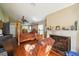Spacious main bedroom with a four-poster bed, fireplace, and hardwood floors at 742 Seneca Trl, St Cloud, FL 34772