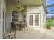 Covered patio featuring a dining table, ceiling fan, and views of the backyard at 742 Seneca Trl, St Cloud, FL 34772