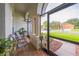 Screened porch with arched doorways and tiled floor, offering a relaxing outdoor space at 742 Seneca Trl, St Cloud, FL 34772