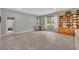 Inviting dining area with large windows, stylish furniture, and tile flooring at 7834 Minutemen Loop, Winter Garden, FL 34787