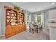 Inviting dining area with a wooden table, chandelier, and charming hutch for displaying china and glassware at 7834 Minutemen Loop, Winter Garden, FL 34787