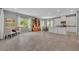 Open-concept kitchen and dining area with large windows and ample natural light at 7834 Minutemen Loop, Winter Garden, FL 34787