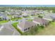 An elevated view highlighting the home's exterior, screened in patio and the community surrounding it at 8865 Se 119Th St, Summerfield, FL 34491