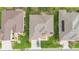 A bird's-eye view reveals the meticulously kept lawn, decorative front yard, and driveway of this charming home at 8865 Se 119Th St, Summerfield, FL 34491