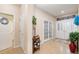Welcoming foyer with decorative accents, tiled floor, and views to other rooms at 8865 Se 119Th St, Summerfield, FL 34491