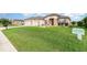Well-maintained home with lush green lawn and charming curb appeal at 8865 Se 119Th St, Summerfield, FL 34491