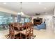 Inviting living and dining area with sliding glass doors, fireplace, and comfortable seating at 8865 Se 119Th St, Summerfield, FL 34491