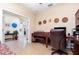 Spacious office with desk, leather chair, and a piano, offering a comfortable workspace at 8865 Se 119Th St, Summerfield, FL 34491