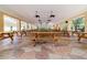 Large, covered picnic area featuring numerous wooden tables, ceiling fans, and an open-air design at 8865 Se 119Th St, Summerfield, FL 34491