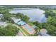 Beautiful aerial view of the community pool, tennis courts, and lake access for residents to enjoy at 9494 Lake Lotta Cir, Gotha, FL 34734