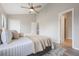 Bedroom featuring a ceiling fan, walk in closet and views to the bath at 9494 Lake Lotta Cir, Gotha, FL 34734