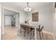 Cozy dining room with modern furnishings and seamless access to the kitchen and living area at 9494 Lake Lotta Cir, Gotha, FL 34734