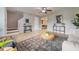 Inviting living room with tile floors, modern decor, and easy access to the dining area and staircase at 9494 Lake Lotta Cir, Gotha, FL 34734