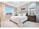 This bedroom features light-colored walls, plush carpeting, and large windows that let in plenty of natural light at 9533 Mere Pkwy, Orlando, FL 32832