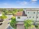 The exterior of a home shows an attached garage, tiled roof, and verdant landscaping surrounding the driveway and entrance at 9533 Mere Pkwy, Orlando, FL 32832