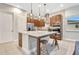 Kitchen features a large island with seating, stainless steel appliances, and wooden cabinetry at 9533 Mere Pkwy, Orlando, FL 32832
