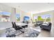 Bright living room with tile floors, neutral walls, large windows and combined dining area at 9533 Mere Pkwy, Orlando, FL 32832