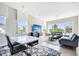 Spacious living room with tile flooring, natural light, and modern gray sofas at 9533 Mere Pkwy, Orlando, FL 32832