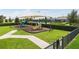 Community playground with slides, climbing structures, and shaded seating area at 9533 Mere Pkwy, Orlando, FL 32832