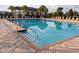 Inviting community swimming pool with clear water and ample seating area at 9533 Mere Pkwy, Orlando, FL 32832
