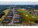 Aerial view of Reunion, FL, featuring luxurious homes, a golf course, and meticulously manicured landscaping at 1041 Castle Pines Ct, Reunion, FL 34747