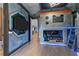 Whimsical themed bedroom with custom bunk beds, ladder, and entertainment center at 1041 Castle Pines Ct, Reunion, FL 34747