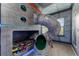 Fun themed bedroom featuring custom bunk beds with slide and unique portal windows at 1041 Castle Pines Ct, Reunion, FL 34747