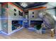 Unique themed bedroom with custom bunk beds, slide, and special lighting at 1041 Castle Pines Ct, Reunion, FL 34747