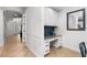 Hallway built-in desk features granite countertop and blue backsplash, offering a functional workspace at 1041 Castle Pines Ct, Reunion, FL 34747