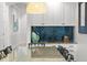Well lit dining room featuring a glass table and contemporary decor with bar access, ideal for entertaining at 1041 Castle Pines Ct, Reunion, FL 34747