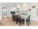 Bright dining room features decorative lighting, modern furniture, and ample natural light at 1041 Castle Pines Ct, Reunion, FL 34747